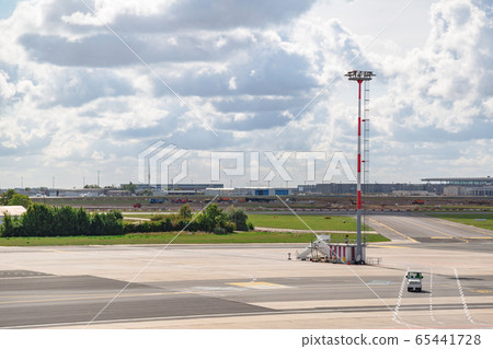 Empty airfield with control tower and company car Empty airfield with control tower and company car 65441728