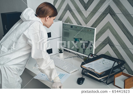 Charming lady analyzing global trading transfers at work 65441923