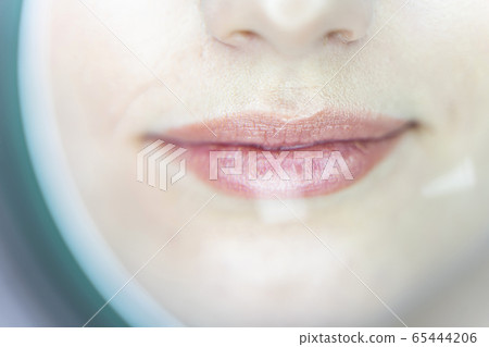 Procedure of facial skin examination in a beauty salon 65444206