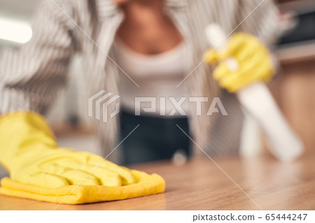 Close up of female hand that wiping dust 65444247
