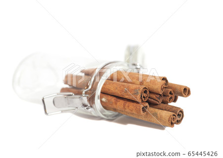 Cinnamon sticks in the Glass Isolated on White 65445426