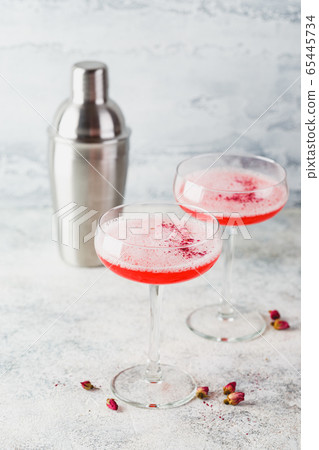 Pink Raspberry Cocktail in drink glass Pink Raspberry Cocktail in drink glass 65445734