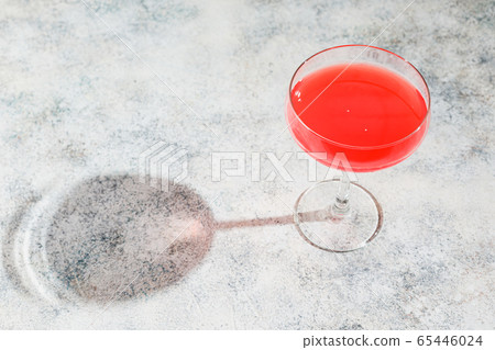 Pink Raspberry Cocktail in drink glass 65446024