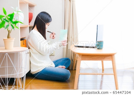 Woman writing message card Copy space Woman writing message card Copy space 65447104
