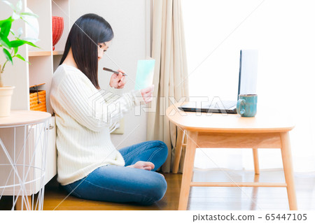 Woman writing message card Copy space Woman writing message card Copy space 65447105