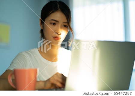 A woman at home 65447297