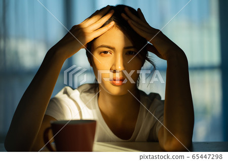 A woman at home 65447298