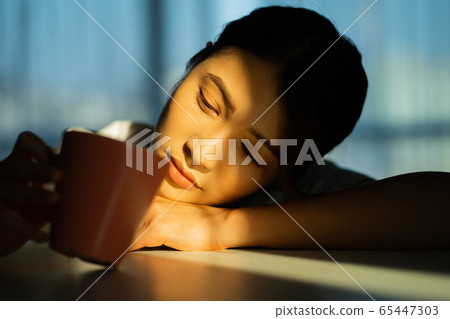 A woman at home 65447303