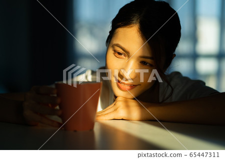 A woman at home 65447311