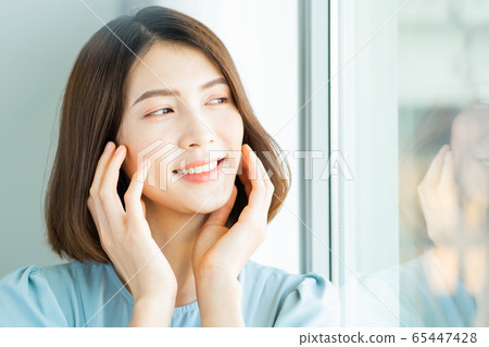 A beautiful woman at home A beautiful woman at home 65447428