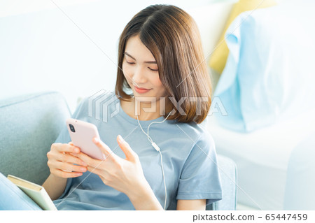 A beautiful woman at home A beautiful woman at home 65447459