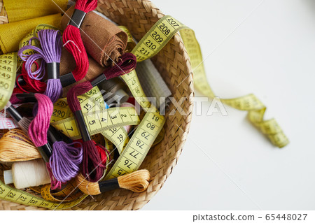 Sewing items in basket 65448027