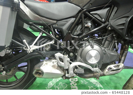 KUALA LUMPUR, MALAYSIA -MARCH 31, 2018: BENELLI motorcycle brand and logos at the motorcycle body. BENELLI motorcycle is originally made in Italy but now manufactured by China KUALA LUMPUR, MALAYSIA -MARCH 31, 2018: BENELLI motorcycle brand and logos at the motorcycle body. BENELLI motorcycle is originally made in Italy but now manufactured by China 65448128