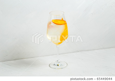 Cool refreshing cocktail with orange lemon zest Cool refreshing cocktail with orange lemon zest 65449044