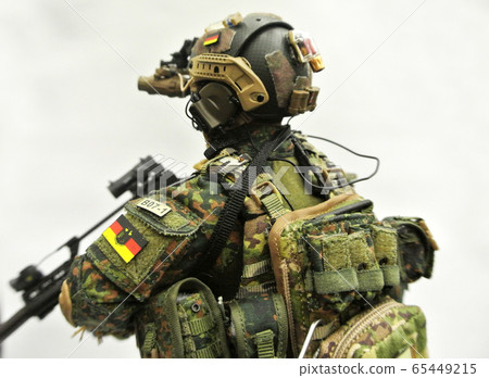 KUALA LUMPUR, MALAYSIA -MAY 3, 2018: Selected focused of modern army action figure complete with uniform, battle gear and weapon. Collector item action figure with very high detail.  65449215