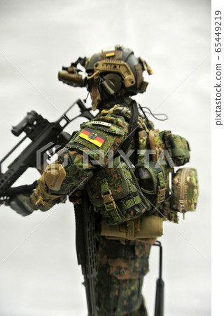 KUALA LUMPUR, MALAYSIA -MAY 3, 2018: Selected focused of modern army action figure complete with uniform, battle gear and weapon. Collector item action figure with very high detail.  65449219