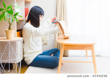 Woman opening a mail copy space 65449296