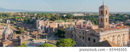 Aetial view to the tower of the Campidoglio and ruins of Basilica Julia and Roman Forum, Rome, Italy. 65449305