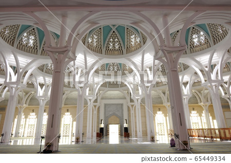 SARAWAK, MALAYSIA -OCTOBER 14, 2014: The interior of Sarawak State Mosque. The mosque has one big main prayer hall covered with one big and beautiful dome and supported with other small domes.  65449334