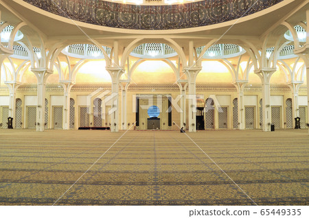 SARAWAK, MALAYSIA -OCTOBER 14, 2014: The interior of Sarawak State Mosque. The mosque has one big main prayer hall covered with one big and beautiful dome and supported with other small domes.  65449335