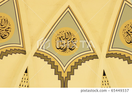 SARAWAK, MALAYSIA -OCTOBER 14, 2014: The interior of Sarawak State Mosque. The mosque has one big main prayer hall covered with one big and beautiful dome and supported with other small domes.  65449337