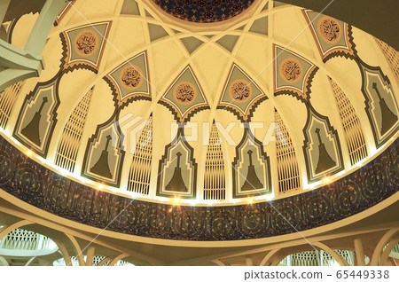 SARAWAK, MALAYSIA -OCTOBER 14, 2014: The interior of Sarawak State Mosque. The mosque has one big main prayer hall covered with one big and beautiful dome and supported with other small domes.  65449338