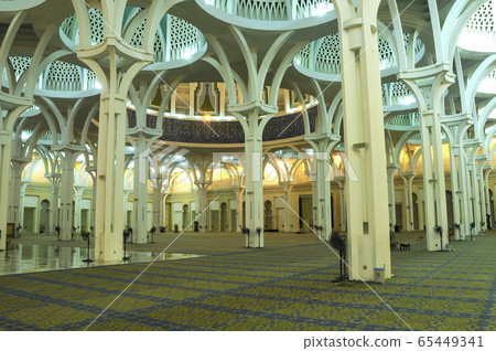 SARAWAK, MALAYSIA -OCTOBER 14, 2014: The interior of Sarawak State Mosque. The mosque has one big main prayer hall covered with one big and beautiful dome and supported with other small domes.  65449341