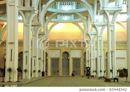 SARAWAK, MALAYSIA -OCTOBER 14, 2014: The interior of Sarawak State Mosque. The mosque has one big main prayer hall covered with one big and beautiful dome and supported with other small domes.  65449342