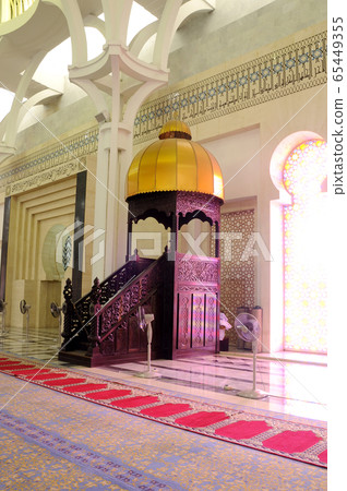 SARAWAK, MALAYSIA -OCTOBER 14, 2014: The interior of Sarawak State Mosque. The mosque has one big main prayer hall covered with one big and beautiful dome and supported with other small domes.  65449355