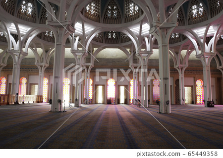 SARAWAK, MALAYSIA -OCTOBER 14, 2014: The interior of Sarawak State Mosque. The mosque has one big main prayer hall covered with one big and beautiful dome and supported with other small domes.  65449358