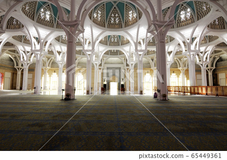 SARAWAK, MALAYSIA -OCTOBER 14, 2014: The interior of Sarawak State Mosque. The mosque has one big main prayer hall covered with one big and beautiful dome and supported with other small domes.  65449361