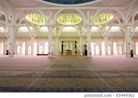 SARAWAK, MALAYSIA -OCTOBER 14, 2014: The interior of Sarawak State Mosque. The mosque has one big main prayer hall covered with one big and beautiful dome and supported with other small domes.  65449362