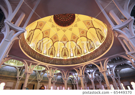 SARAWAK, MALAYSIA -OCTOBER 14, 2014: The interior of Sarawak State Mosque. The mosque has one big main prayer hall covered with one big and beautiful dome and supported with other small domes.  65449370