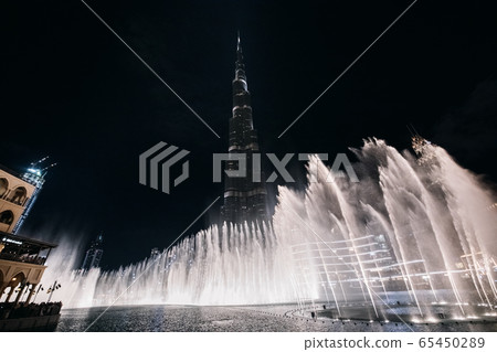 Night view of the Dubai Fountain and Burj Khalifa, the tallest building in the world. Night view of the Dubai Fountain and Burj Khalifa, the tallest building in the world. 65450289