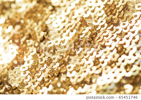Sparkling golden sequined fabric. Sparkling golden sequined fabric. 65451746