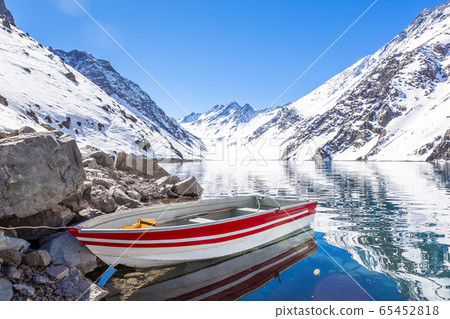 ski in chile on a sunny day with lots of snow. 65452818