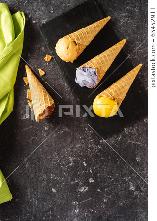 Top view of many bright yellow and violet ice Top view of many bright yellow and violet ice 65452911