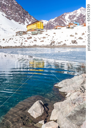 ski in chile on a sunny day with lots of snow. 65453299