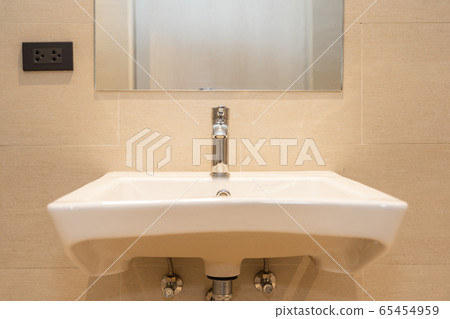 White sink with water faucet decoration in bathroom White sink with water faucet decoration in bathroom 65454959