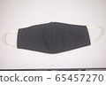 Black cloth mask for virus protection on white background .  65457270