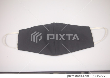Black cloth mask for virus protection on white background . Black cloth mask for virus protection on white background . 65457270