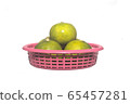 Many Thailand lemons arranged in a red basket isolate on white background . object for thai asian food advertising product 65457281