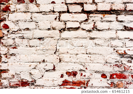Texture of a brick wall with cracks and scratches Texture of a brick wall with cracks and scratches 65461215