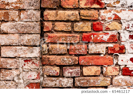 Texture of a brick wall with cracks and scratches Texture of a brick wall with cracks and scratches 65461217