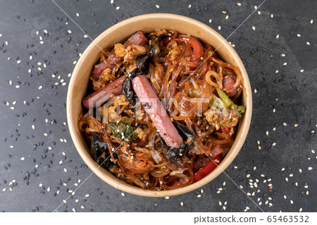 Stir fry noodle with chicken in a wok pan Stir fry noodle with chicken in a wok pan 65463532