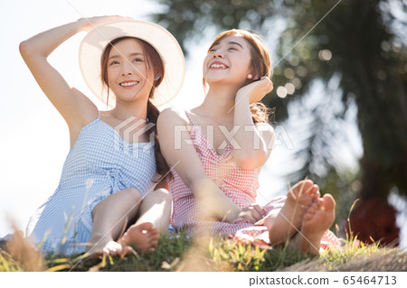 Young women enjoying a resort trip 65464713