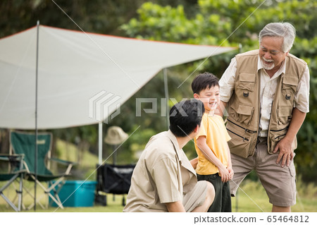 Three generations of families enjoying the outdoors 65464812