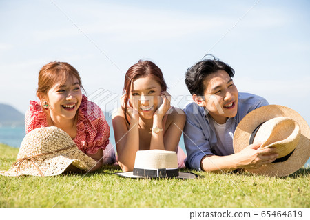 Male and female friends enjoying a resort trip 65464819