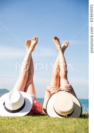 Woman enjoying a resort trip Woman enjoying a resort trip 65464895