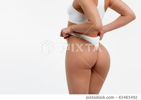 Unrecognizable sensual female model in underwear 65465492